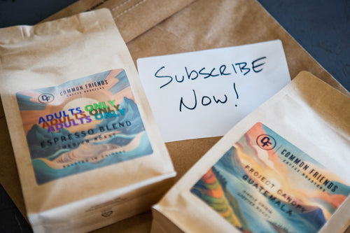 Common Friends coffee bags with a handwritten Subscribe Now card